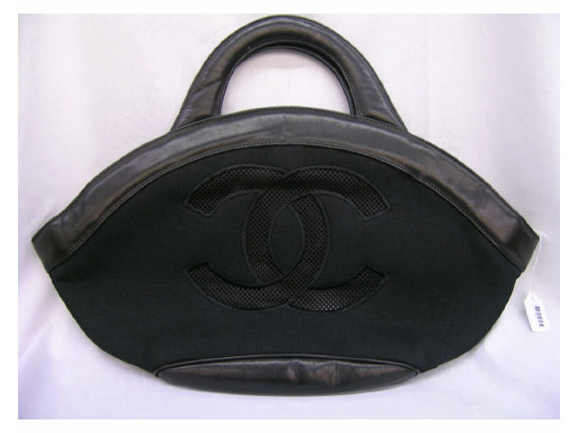 Appraisal: Chanel handbag leather and canvas with logo and flower zipper