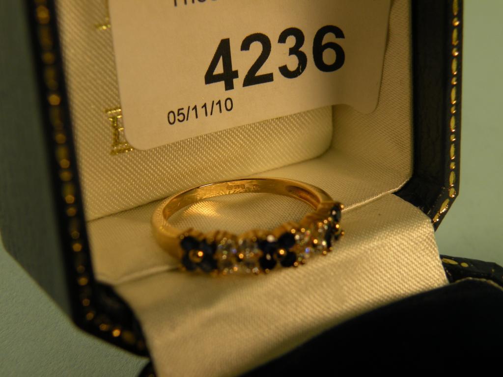 Appraisal: A carat gold sapphire and diamond ring retailed by Brooks