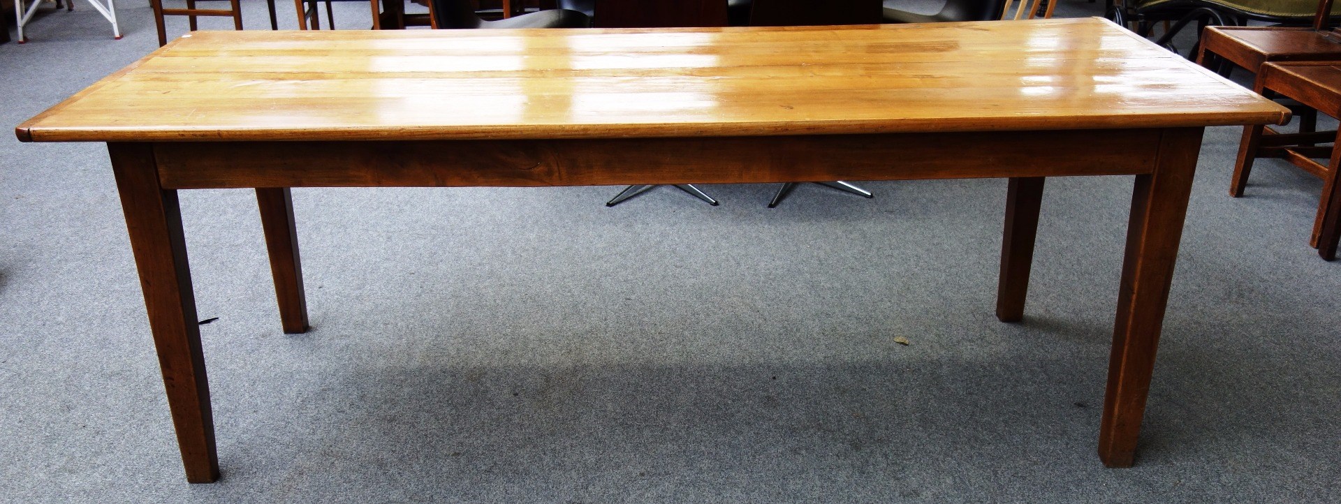 Appraisal: A th century French fruitwood kitchen table the cleated plank