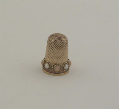 Appraisal: A late Victorian gold thimble set with alternating half pearls