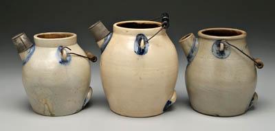 Appraisal: Three stoneware batter pitchers all with cobalt highlights wire bails