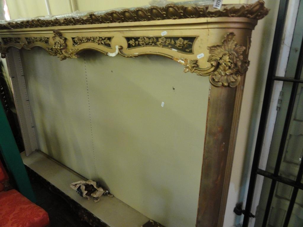 Appraisal: A slender gilt framed open bookcase display case with decorative