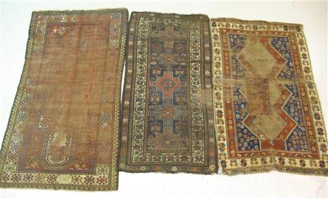 Appraisal: THREE ORIENTAL RUGS WITH RED AND NAVY GROUND Provenance Estate