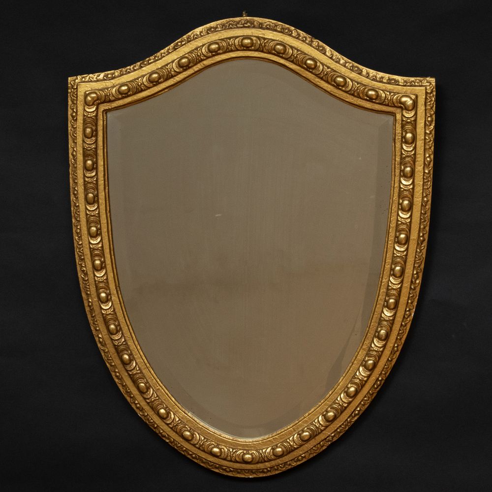 Appraisal: English Giltwood Shield Shaped Mirror Fitted with a beveled glass