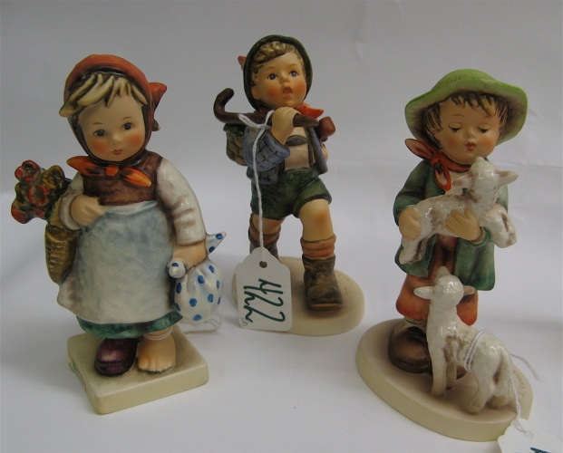 Appraisal: THREE GERMAN HUMMEL FIGURES Weary Wanderer HUM - H TM-