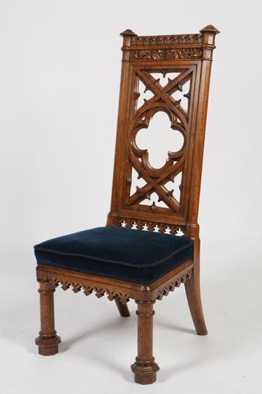 Appraisal: A VICTORIAN OAK GOTHIC REVIVAL HALL CHAIR the tall back