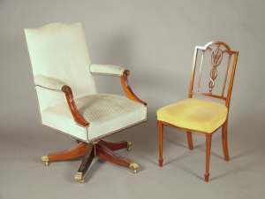 Appraisal: A Reproduction upholstered Gainsborough swivel chair together with a mahogany