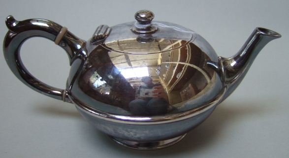 Appraisal: A French plated bachelors teapot of circular form detailed CHRISTOFLE