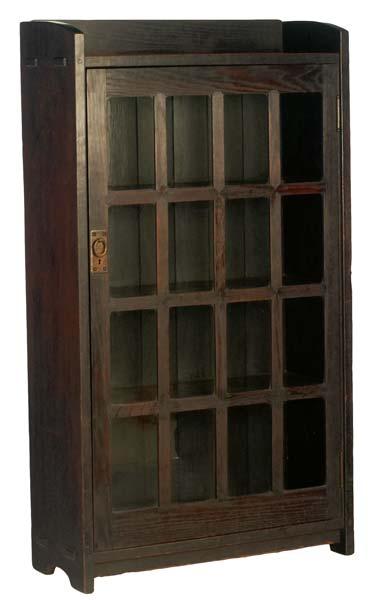 Appraisal: GUSTAV STICKLEY Early single-door bookcase with mitered mullions Large red