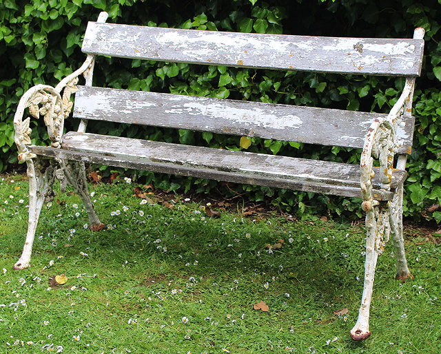 Appraisal: A WHITE PAINTED CAST IRON GARDEN BENCH the ends cast