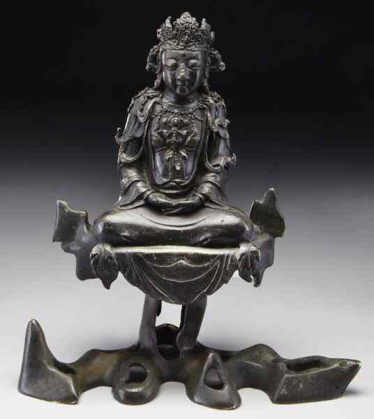 Appraisal: Chinese Ming bronze Guanyin seated on a rock hands in