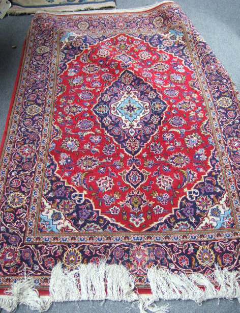 Appraisal: A Kaskan rug Persian the madder field with an indigo