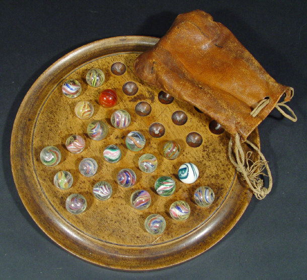 Appraisal: Turned mahogany solitaire board and marbles some with with colourful