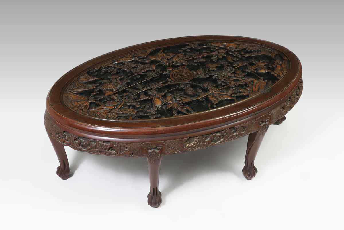 Appraisal: CARVED CHINESE COFFEE TABLE WITH GLASS TOP Detailed carved top