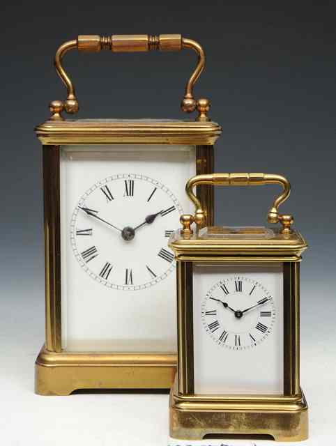 Appraisal: A MINIATURE FRENCH BRASS CARRIAGE TIMEPIECE with white enamel Roman