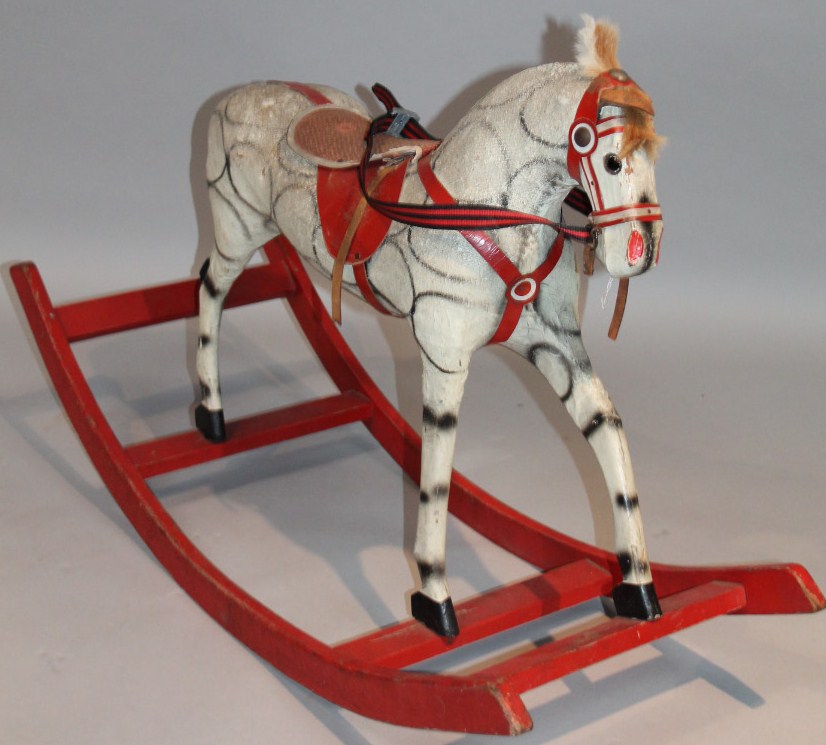 Appraisal: A thC child's miniature rocking horse with straw stuffed dapple