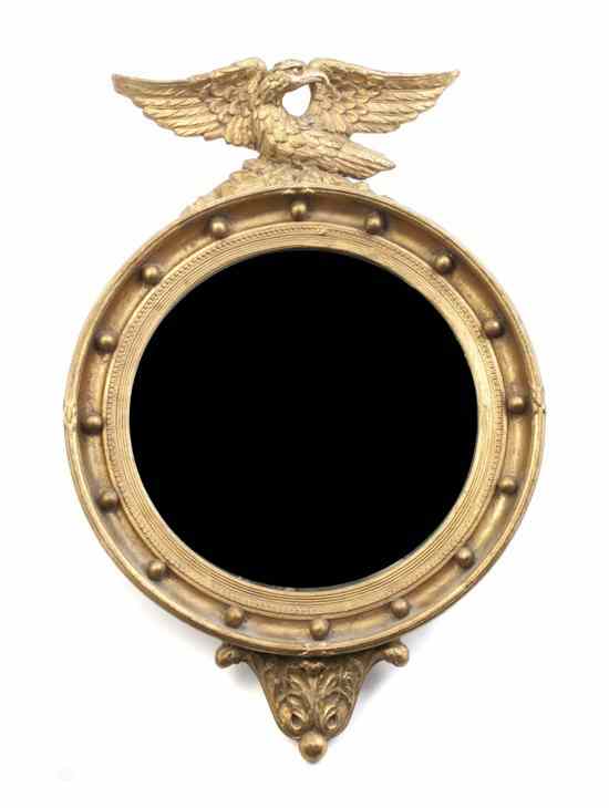 Appraisal: A Federal Style Giltwood Bull's Eye Mirror having an eagle