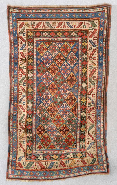 Appraisal: A CAUCASIAN MULTICOLOURED RUG the central multiple diamond motif on