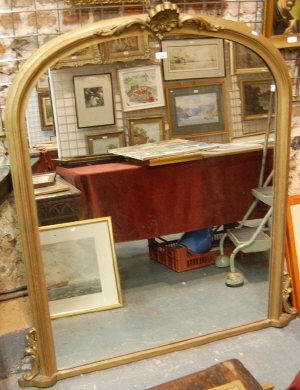 Appraisal: A gilt framed arched overmantel mirror with shell crest cm