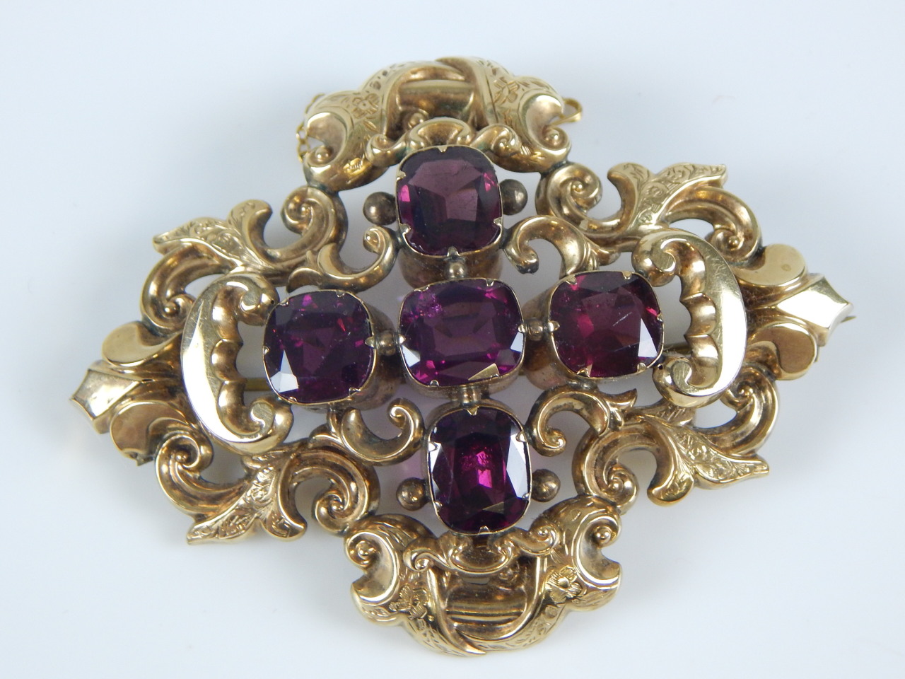 Appraisal: A Victorian large amethyst set ornate brooch in yellow metal