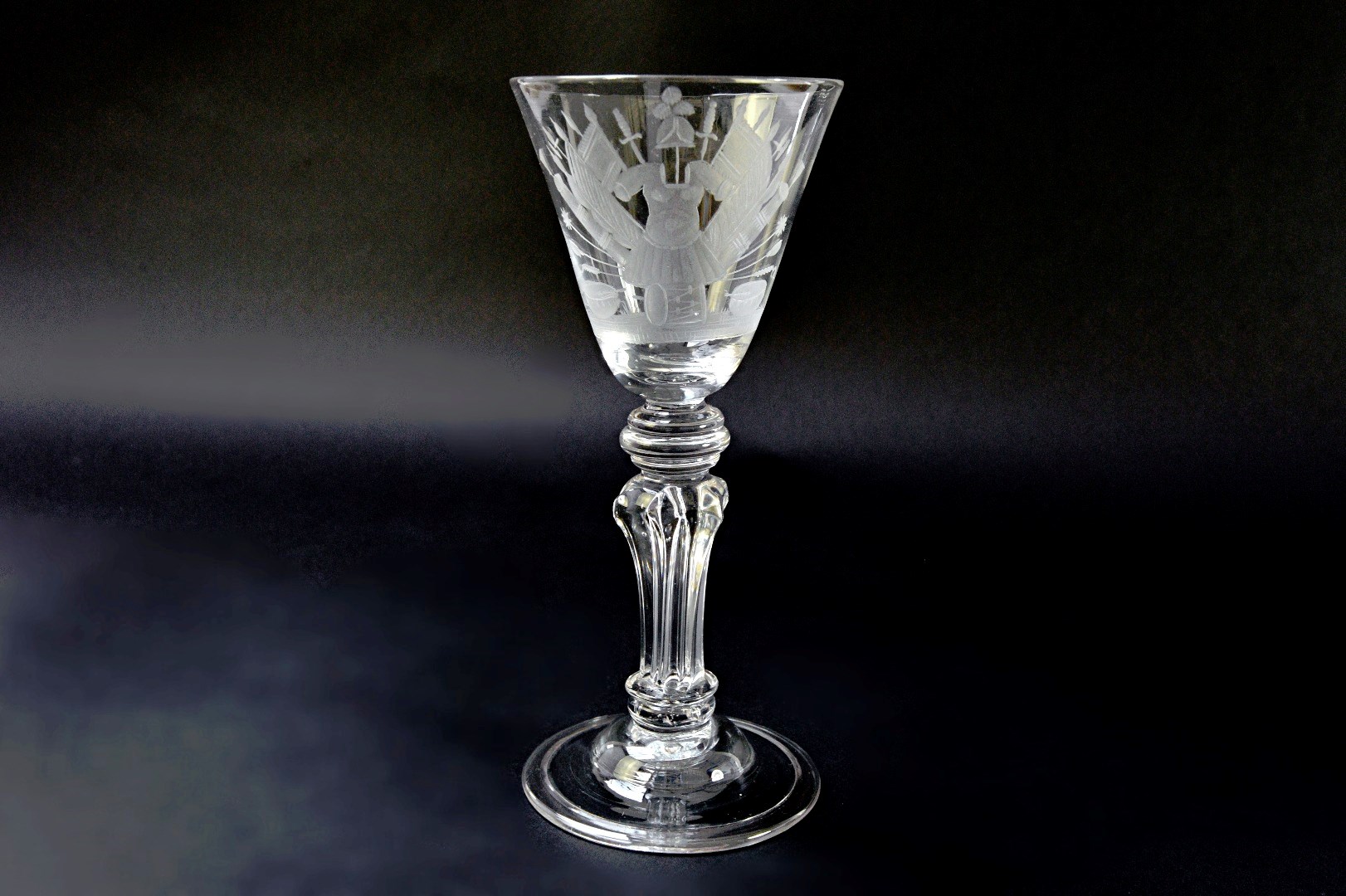 Appraisal: A pedestal stemmed wine glass circa the rounded funnel bowl