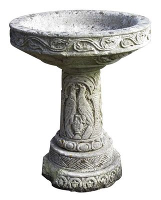 Appraisal: A reconstituted stone birdbath shallow bowl with central pedestal cast