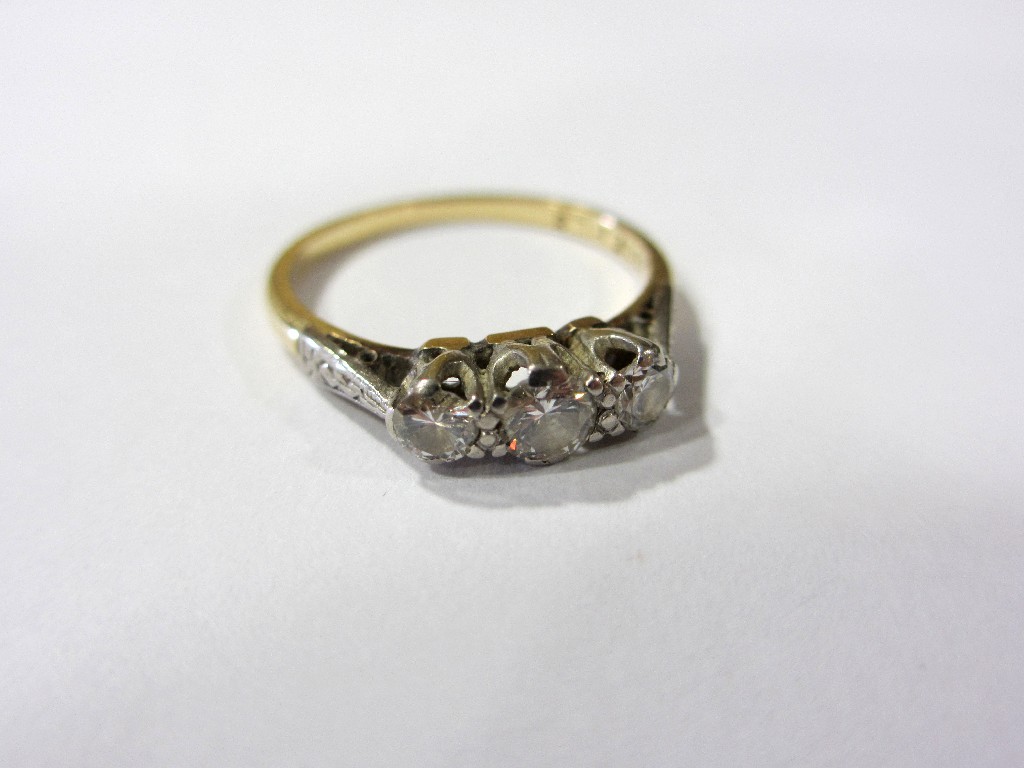 Appraisal: A diamond three stone ring the graduated brilliant of approximately