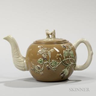 Appraisal: Staffordshire Ochre Ground Teapot and Cover England c globular shape