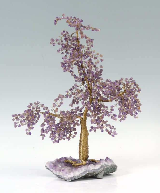 Appraisal: AMETHYST LEAVES GEMSTONE TREE Mounted on an amethyst geode ''