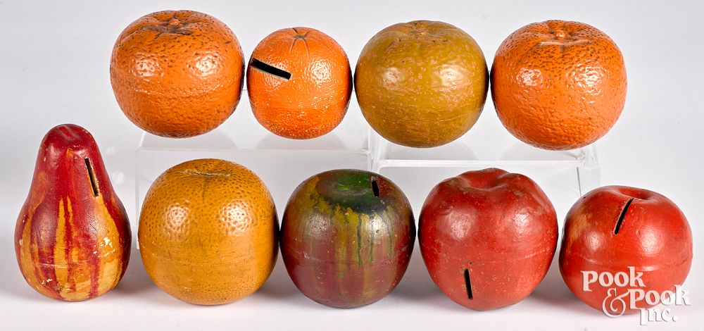 Appraisal: Nine painted redware fruit banks late th c Nine painted