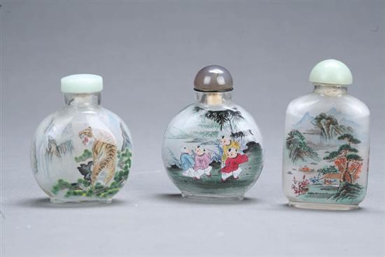 Appraisal: THREE SNUFF BOTTLES China th century glass Reverse painted glass