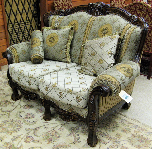 Appraisal: CARVED AND UPHOLSTERED MAHOGANY LOVESEAT Chippendale influence recent Length inches