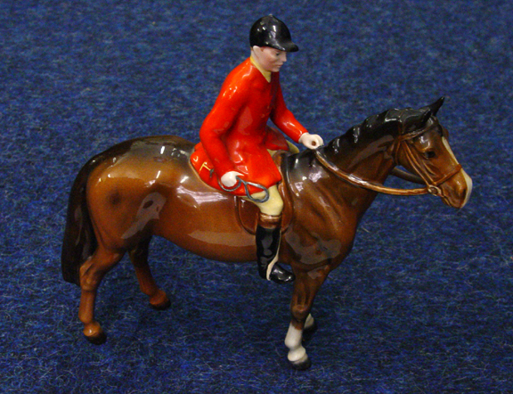 Appraisal: Hand painted Beswick huntsman on brown horseback factory marks to