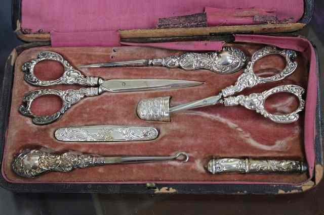 Appraisal: A LATE VICTORIAN SILVER SEWING SET consisting of two pairs