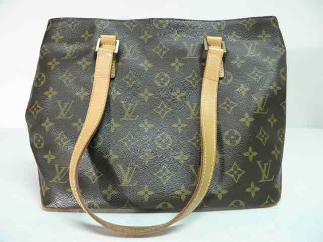 Appraisal: Louis Vuitton brown leather handbag Traditional ''LV'' pattern with lighter