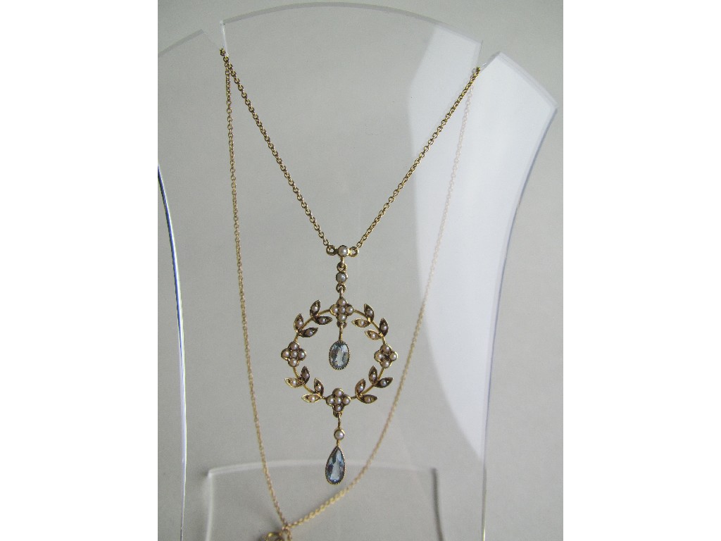 Appraisal: Edwardian ct gold aquamarine and seed pearl set pendant necklace