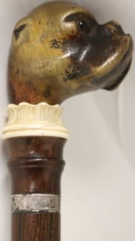 Appraisal: TH C WALKING STICK WITH CARVED FIGURAL BULL DOGHEAD GLASS