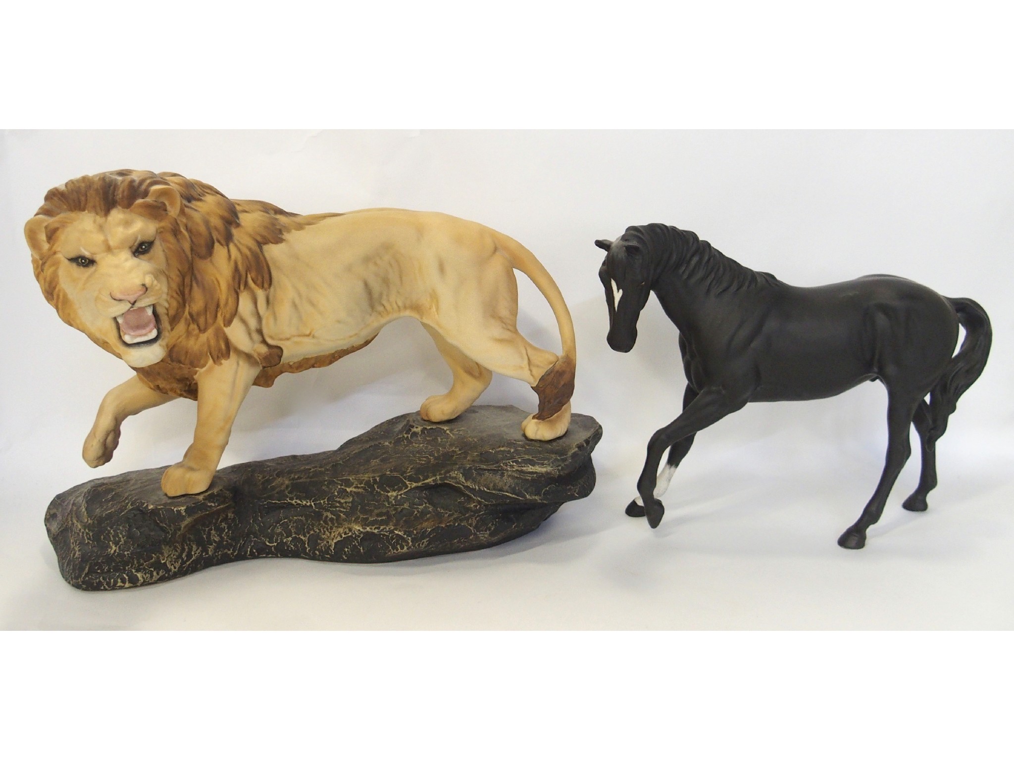 Appraisal: Beswick model of a lion on rocky outcrop and a