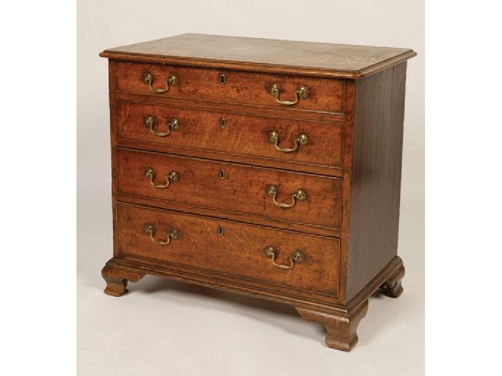 Appraisal: A GEORGE III OAK CHEST OF DRAWERS the rectangular top