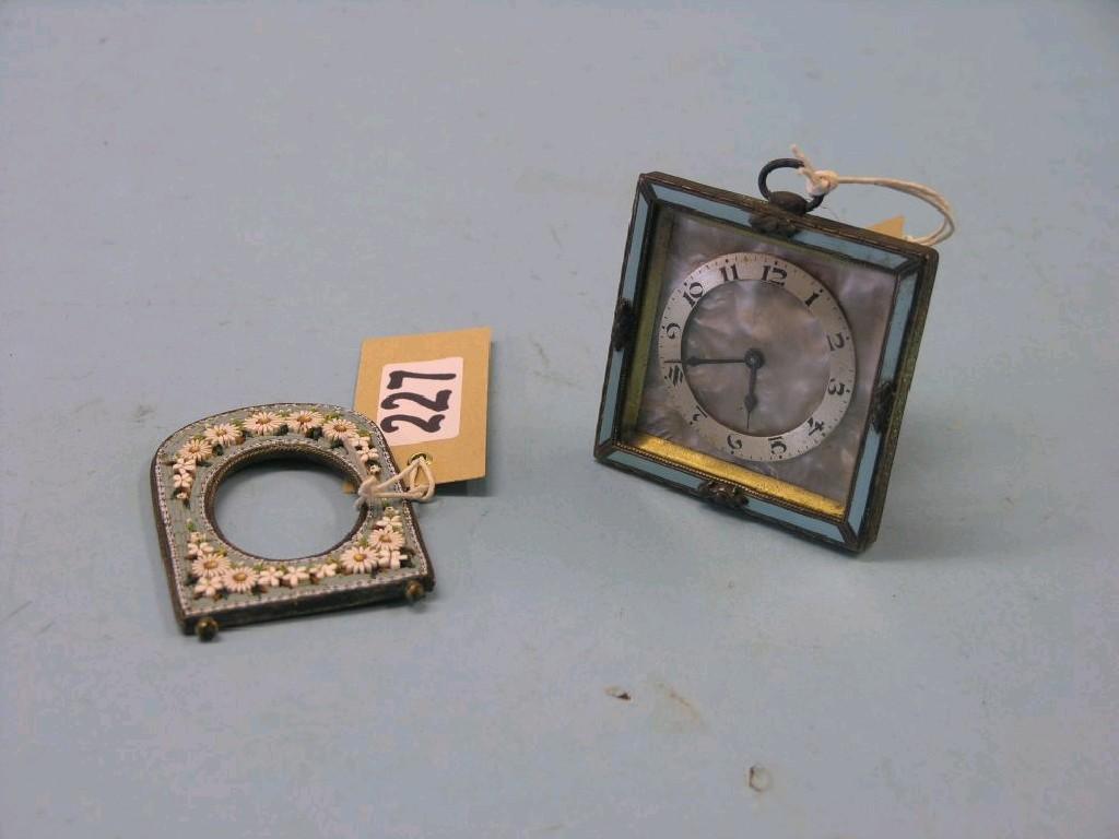 Appraisal: A micro-mosaic photograph frame in and a desk-top strut timepiece