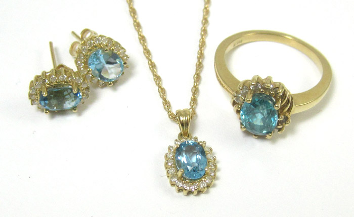 Appraisal: FOUR ARTICLES OF BLUE TOPAZ AND DIAMOND JEWELRY including a