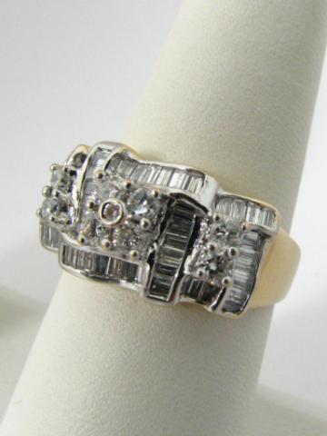 Appraisal: k yellow and white gold diamond cluster ring containing baguette