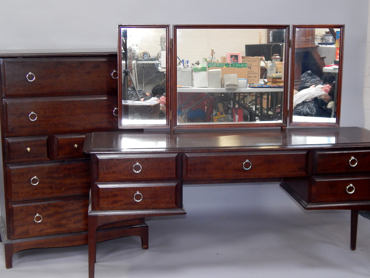 Appraisal: A Stag mahogany chest of four long drawers interspersed with