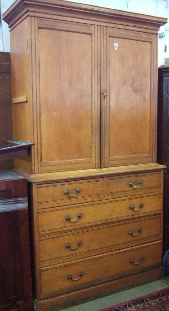 Appraisal: A satinwood linen press