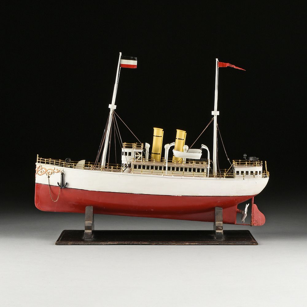 Appraisal: A VINTAGE GERMAN PAINTED TIN STEAM POWERED MODEL BOAT POSSIBLY