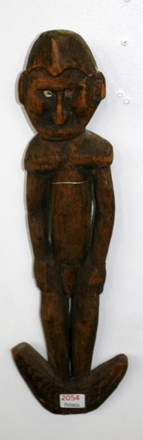 Appraisal: A basket hook carved as a male figure collected Papua