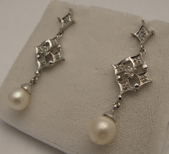 Appraisal: PAIR OF PEARL DIAMOND AND KARAT GOLD EARRINGS each set