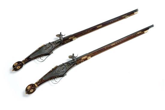 Appraisal: TWO INLAID WHEEL-LOCK PISTOLS Europe th- th century Heavily inlaid