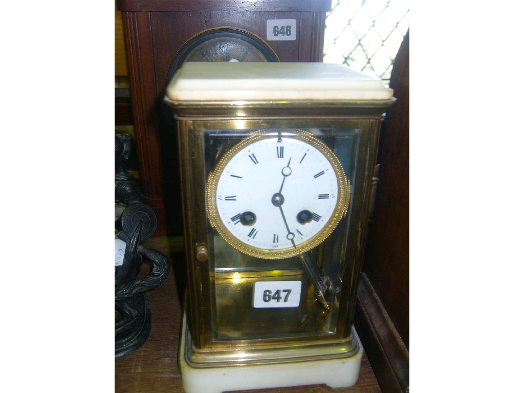 Appraisal: A Victorian white marble and brass -pane mantle clock with