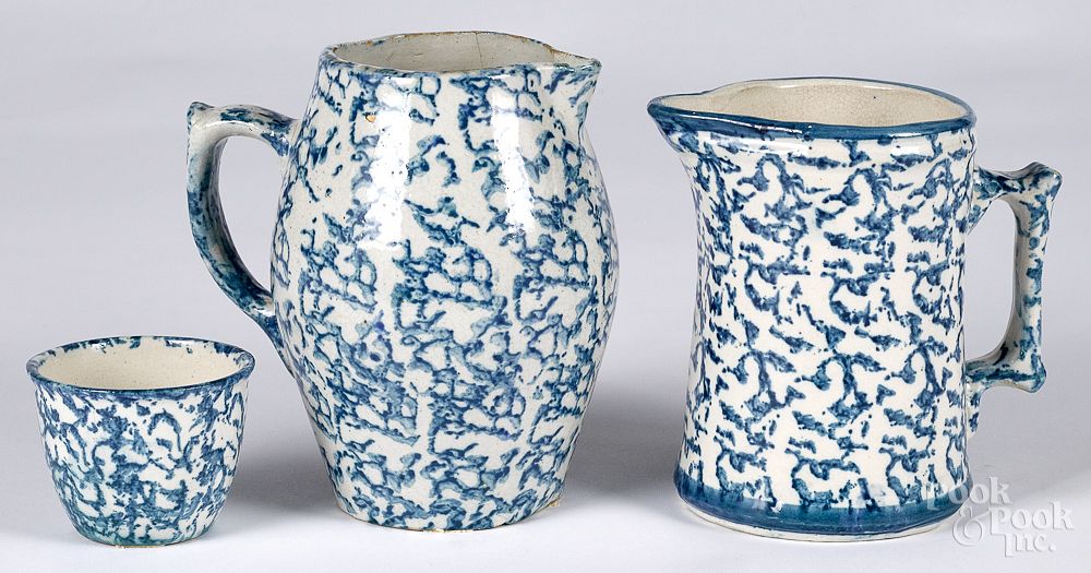 Appraisal: Two blue spongeware pitchers together with a cup Two blue